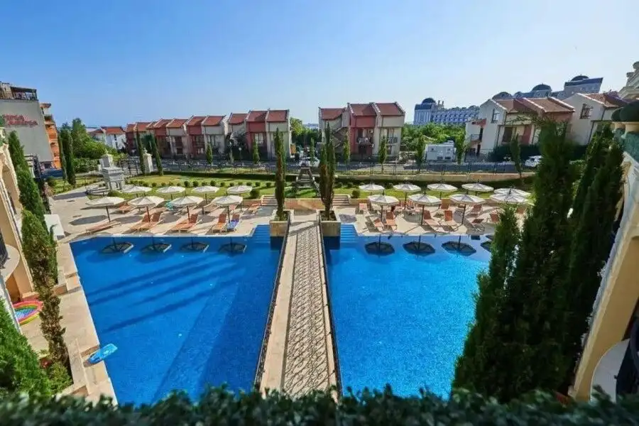 View of the swimming pool and surrounding apartments in Sveti Vlas, near the sea.