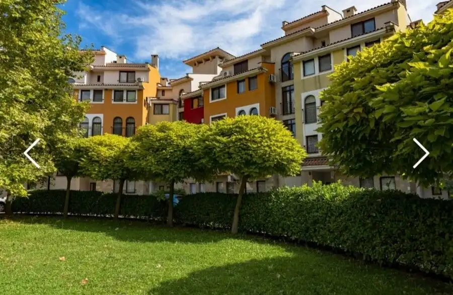 Colorful apartment complex with lush green landscaping at Marina Cape, Aheloy.