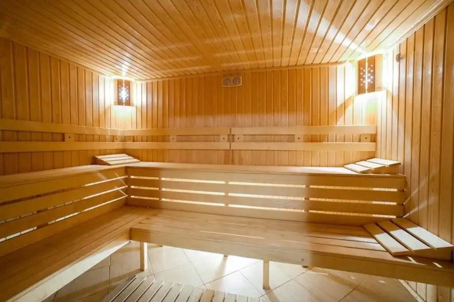 Sauna room with wooden benches in Dawn Park Deluxe spa complex, Sunny Beach.