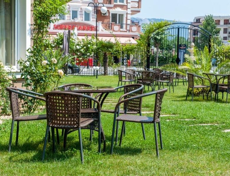 Furnished studio apartment in Dawn Park Deluxe, Sunny Beach with garden seating area and lush greene.