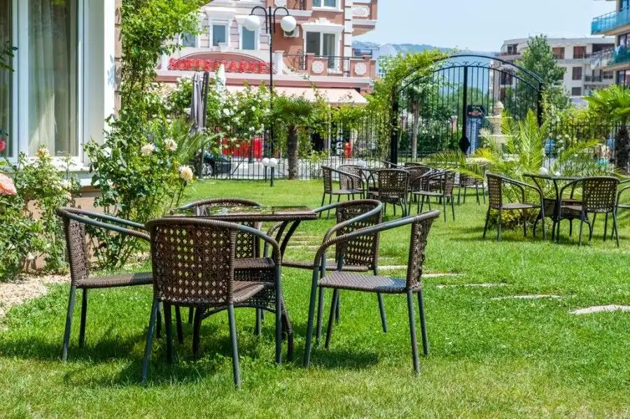 Furnished studio apartment in Dawn Park Deluxe, Sunny Beach with garden seating area and lush greene.