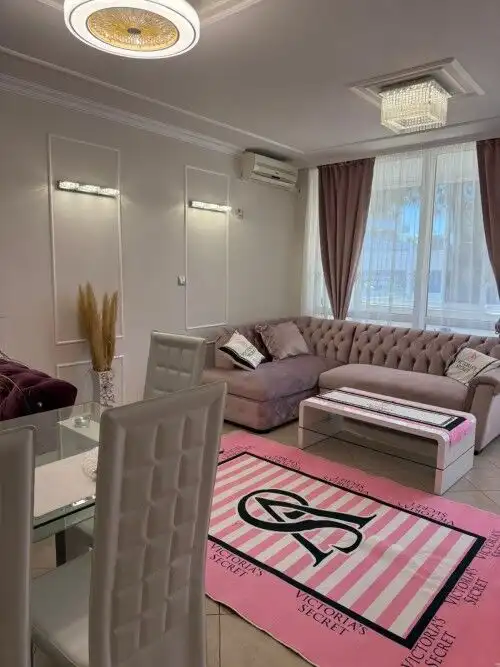 Modern furnished 1-bedroom apartment with living area and dining space in Sunny Beach.