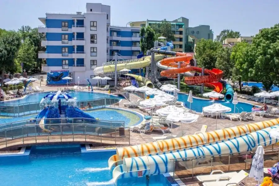 Bright water park featuring multiple slides, pools, and lounging areas in Sunny Beach. Perfect for f.