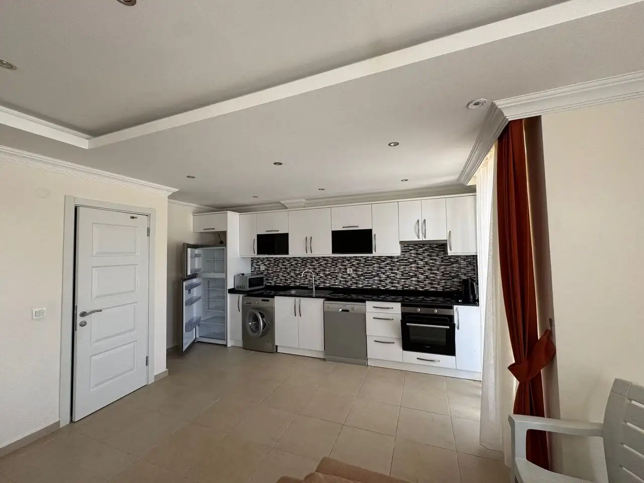 Modern kitchen in luxury apartment in Ovacık, Turkey.