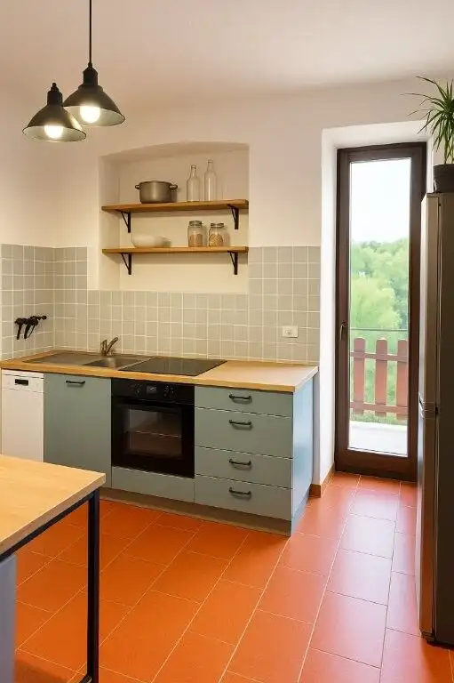 Bright kitchen with natural light and scenic balcony view.