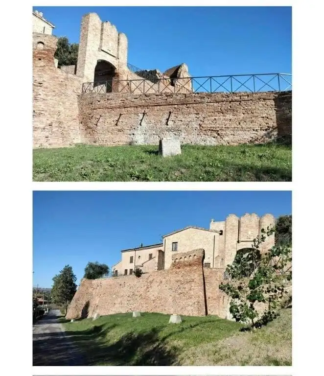 Castle in Coriano Rimini with historic stone walls and modern house integration.