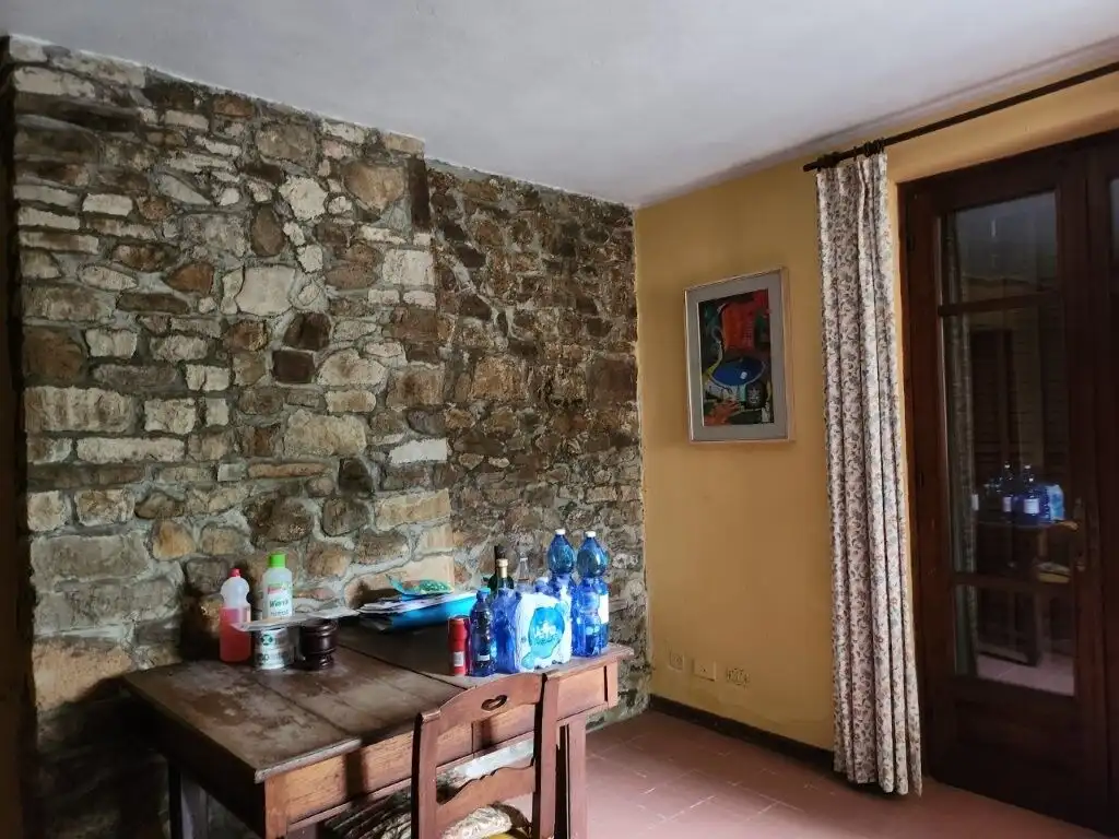 Elegant country villa with five bedrooms in Salsomaggiore Parma, featuring rustic stone walls and sp.
