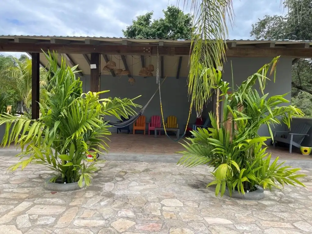 Style villa with lush greenery and relaxing hammock in La Trinidad.