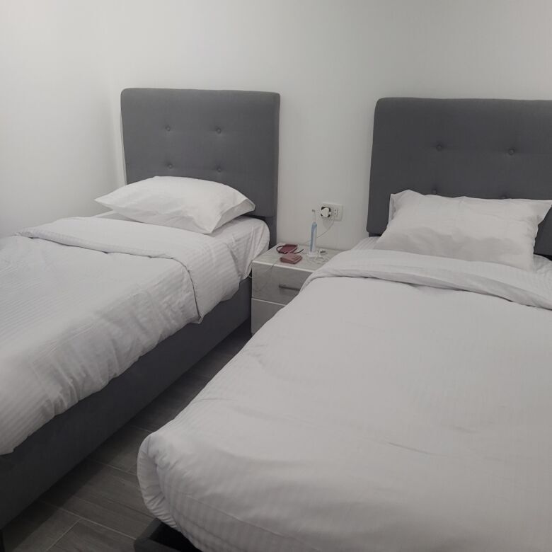 Modern twin bedroom in Imperial Resort Hurghada, perfect for vacation stays.