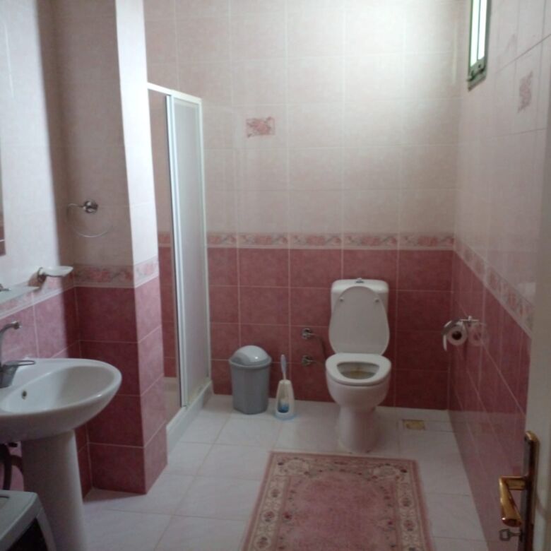 Modern bathroom with shower and toilet in Cesme villa.