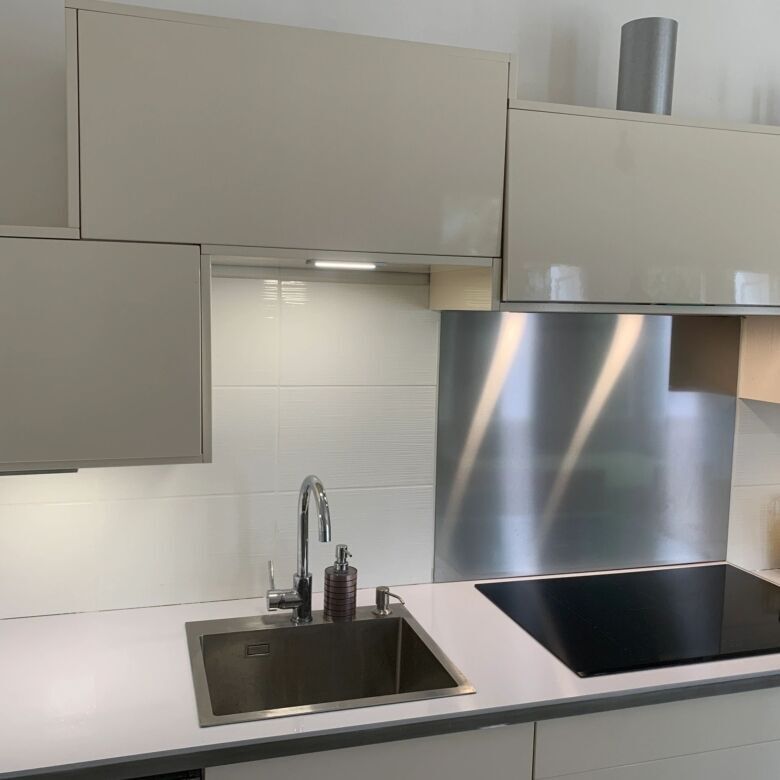 Elegant kitchen in La Paloma villa with modern appliances and sleek design.