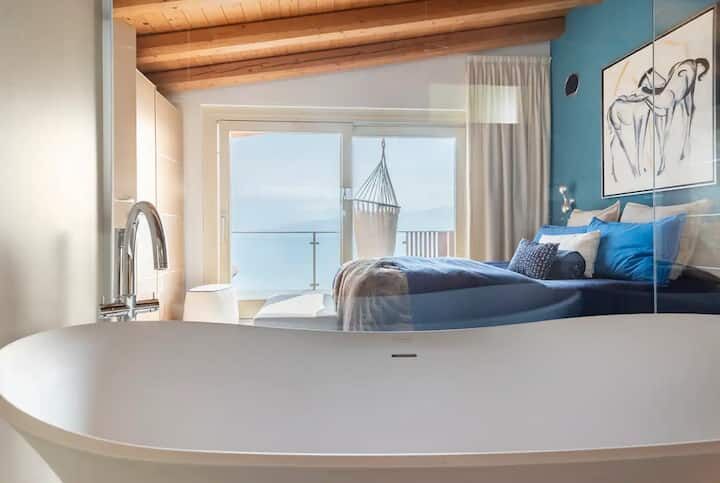 Modern duplex apartment with sea views in Spiglia, featuring stylish interiors and spacious living a.