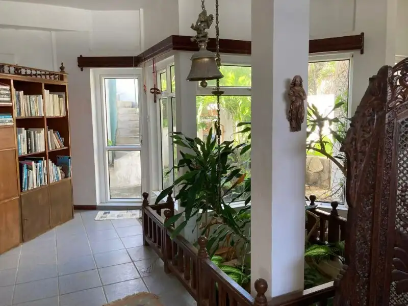Seaside Luxury Living in Mauritius Elegant indoor space with lush greenery and natural light.