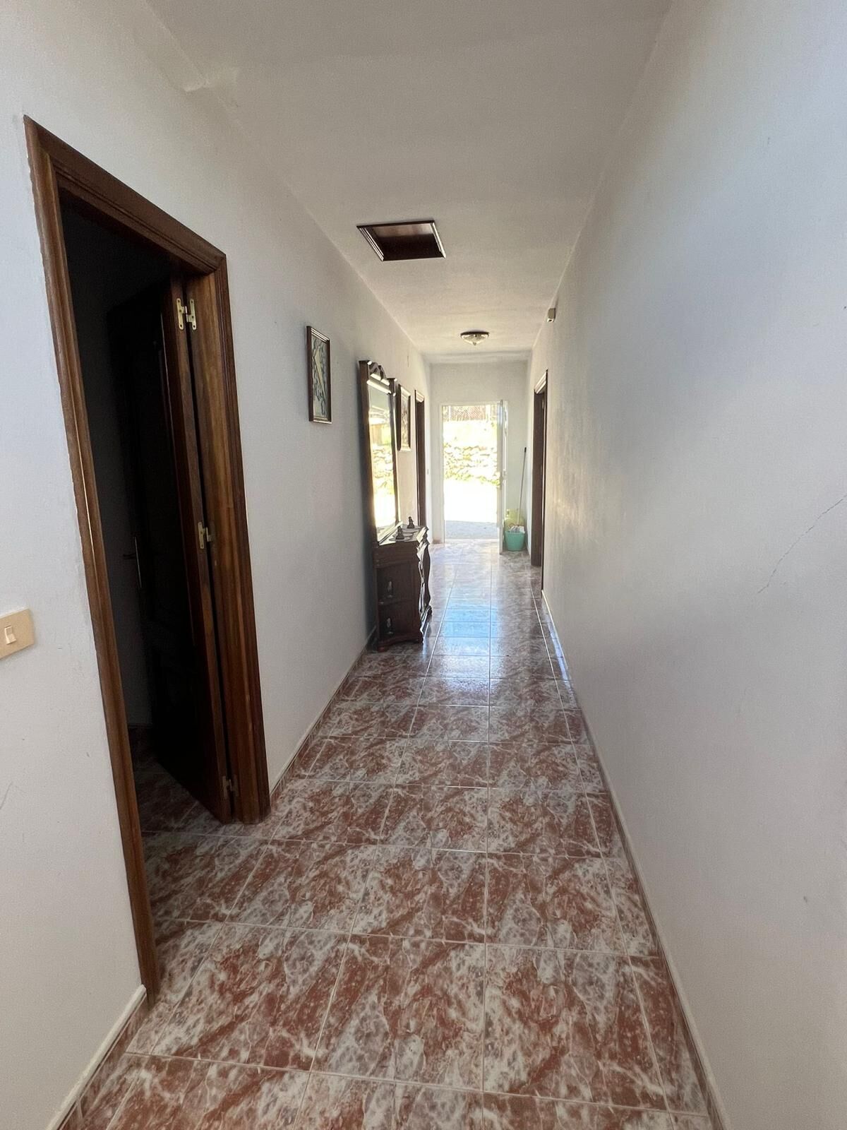 Spacious hallway inside a beautiful 6-bedroom house in Taboada, Galicia. Bright, airy corridor with.