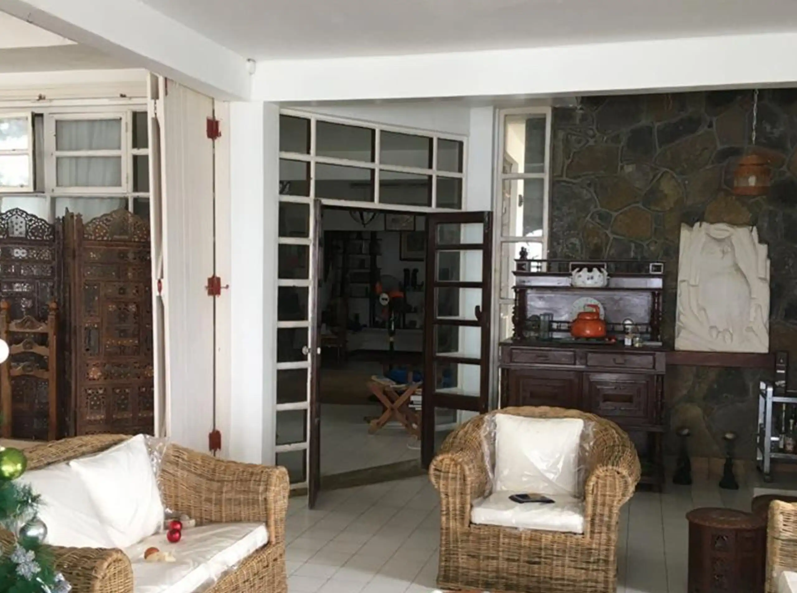 Seaside Luxury Living in Mauritius Elegant living room with coastal decor and natural light.