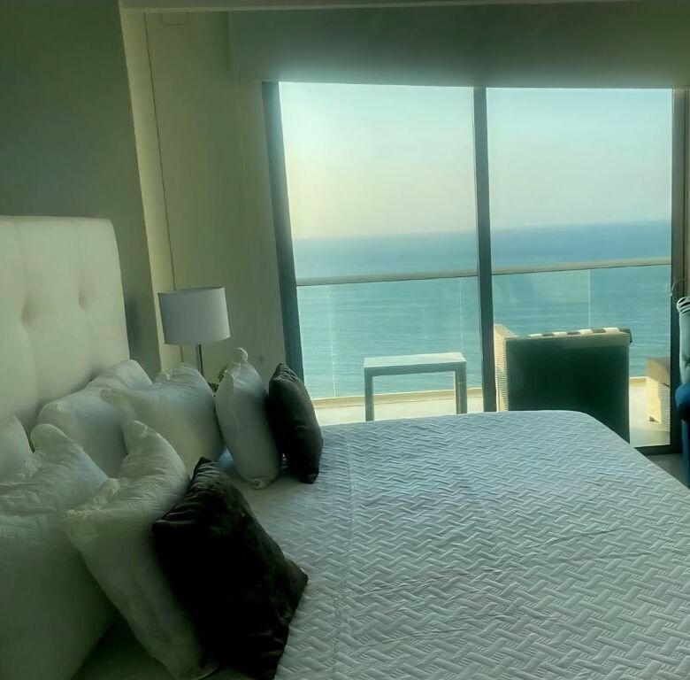 Modern bedroom with ocean view in Gaira Playa Salguero penthouse.