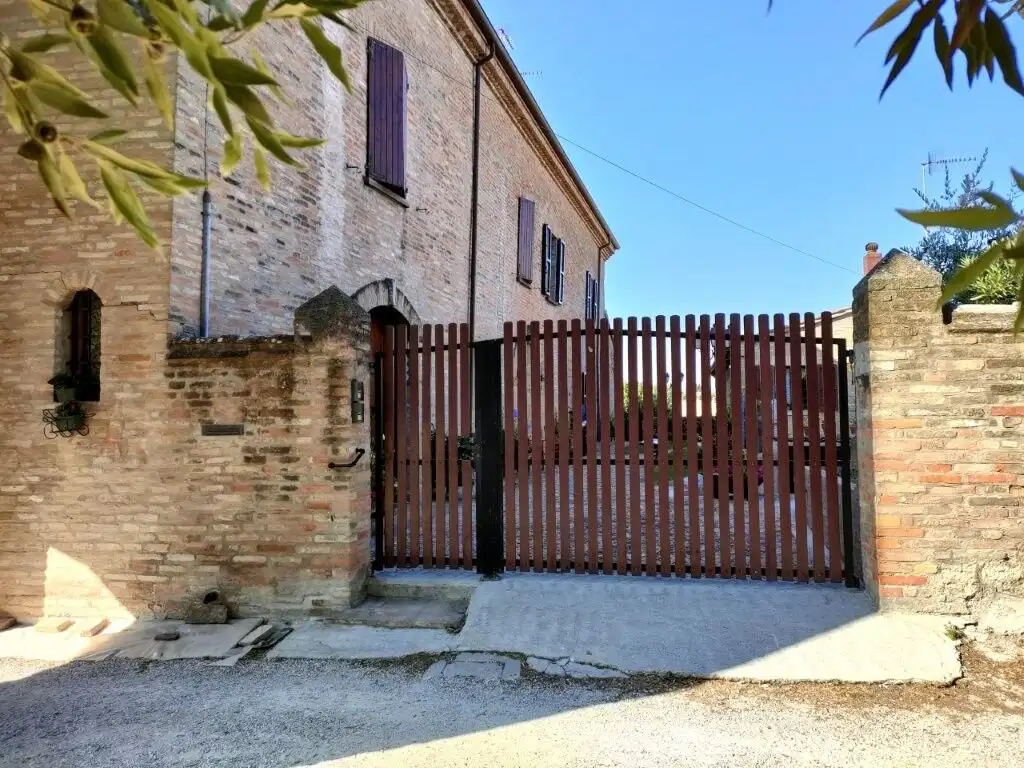 Beautiful entrance gate to a historic castle-style house in Coriano Rimini. Perfect for buyers seeki.