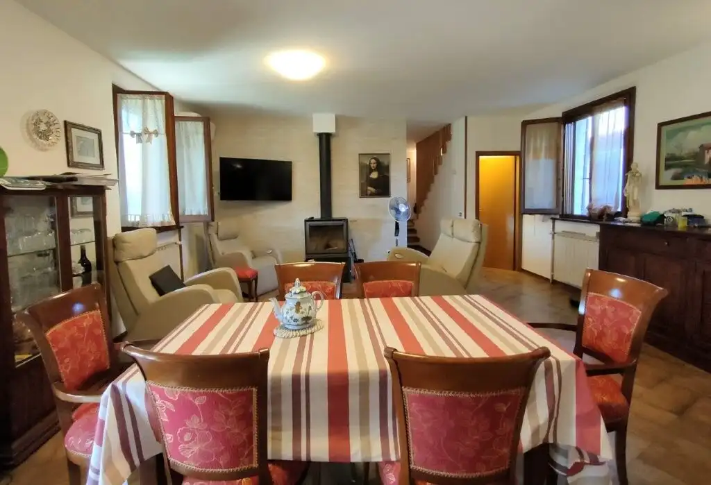 Spacious living room in a historic castle property for sale in Coriano Rimini. Perfect for families.