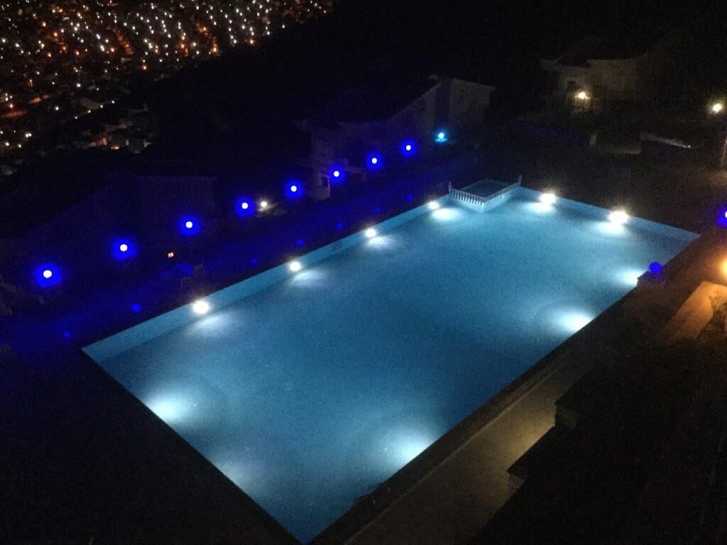 Bright night view of the private swimming pool at Pearl Rock Retreat, Akbuk Didim.