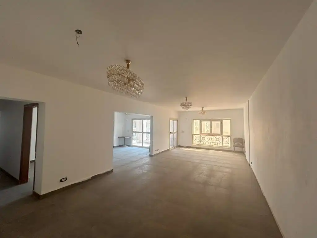 Spacious living room in a luxury 3-bedroom apartment at Al Baron Compound, Cairo, featuring modern d.