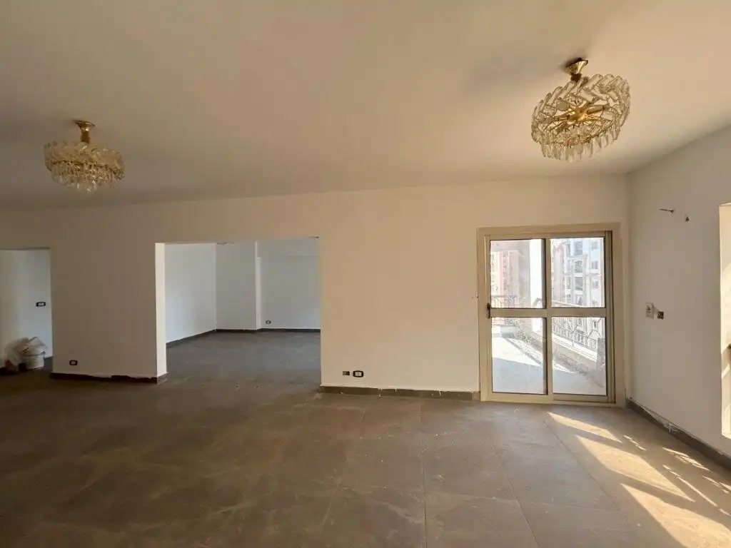 Apartment with spacious living area and balcony in Al Baron Compound, Cairo.