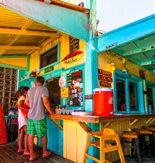Colorful beach food stall with local dishes in San Juan Del Sur, Nicaragua.