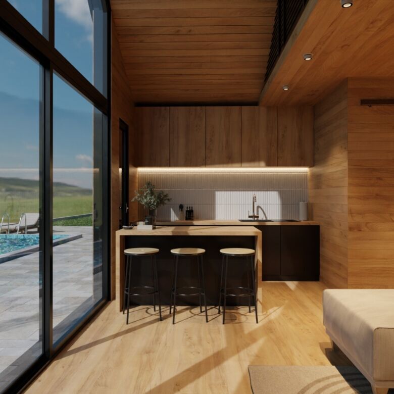 Luxurious villa kitchen with wooden finishes, bar stools, and scenic lake views.