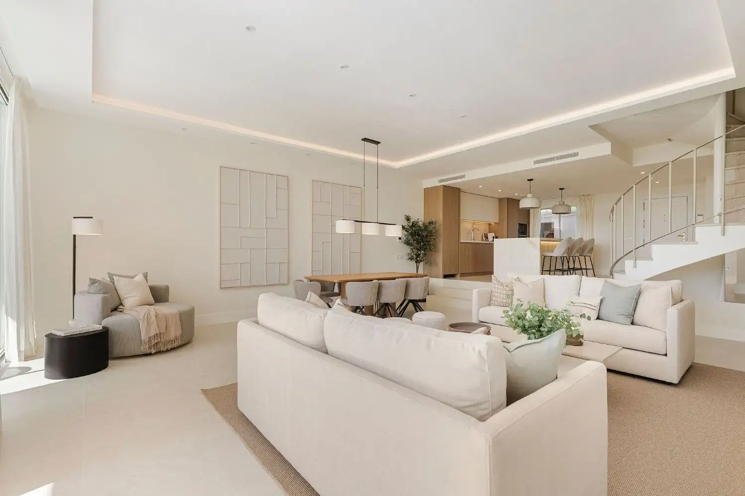 Spacious living room in a fully renovated La Quinta townhouse, featuring modern furniture and elegan.