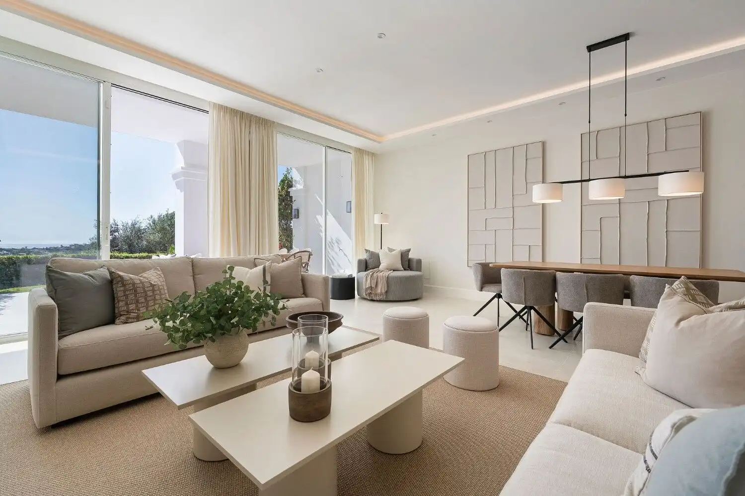 Modern living room with stylish furniture and large windows in La Quinta, Benahavis.