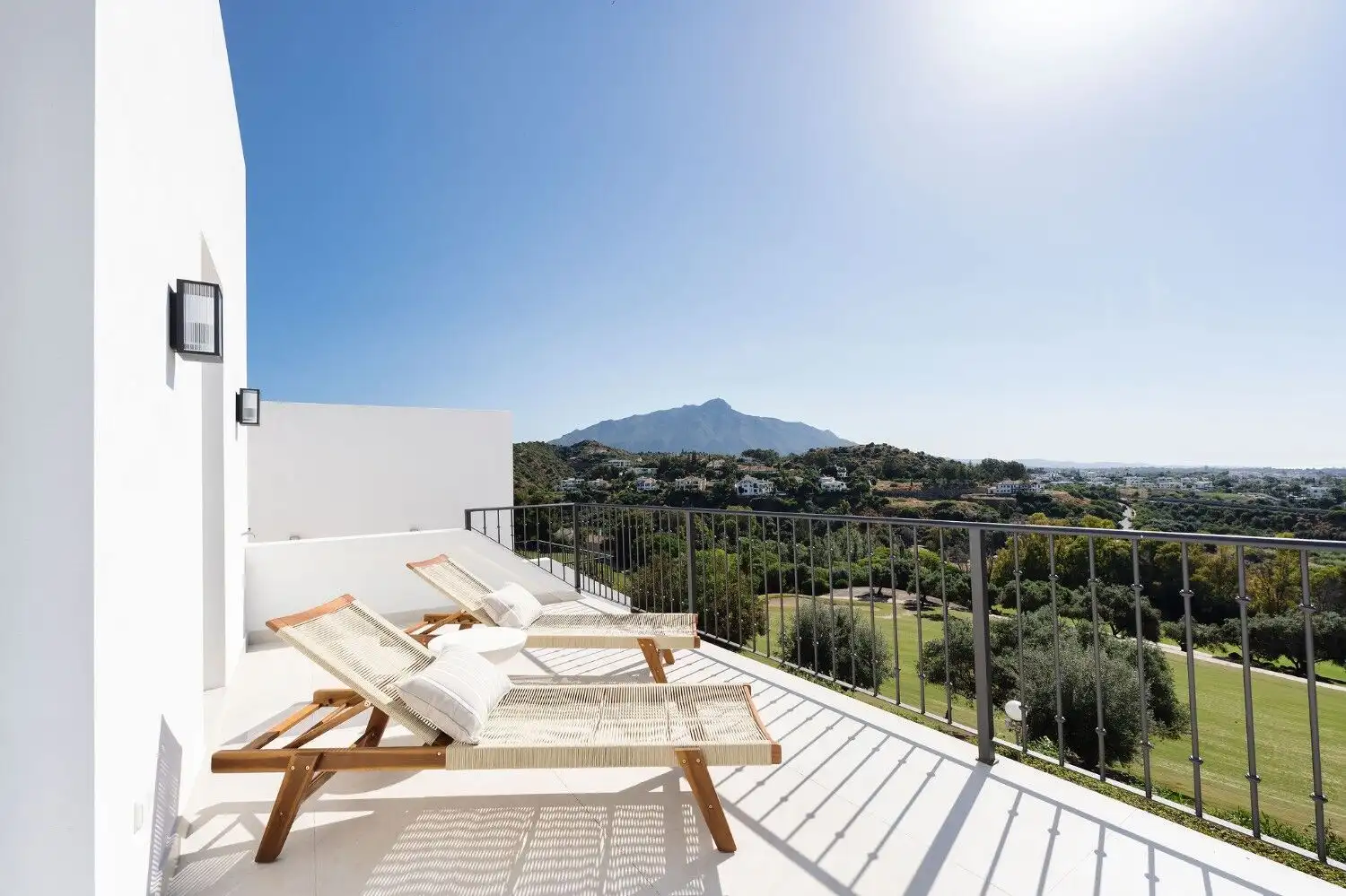 Spacious balcony of La Quinta townhouse offering stunning mountain and landscape views. Perfect for.