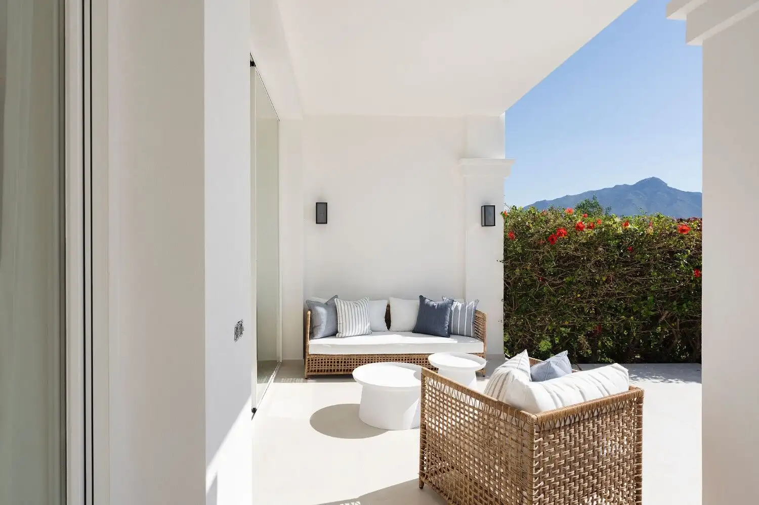 Benahavis townhouse terrace with outdoor seating and mountain views.