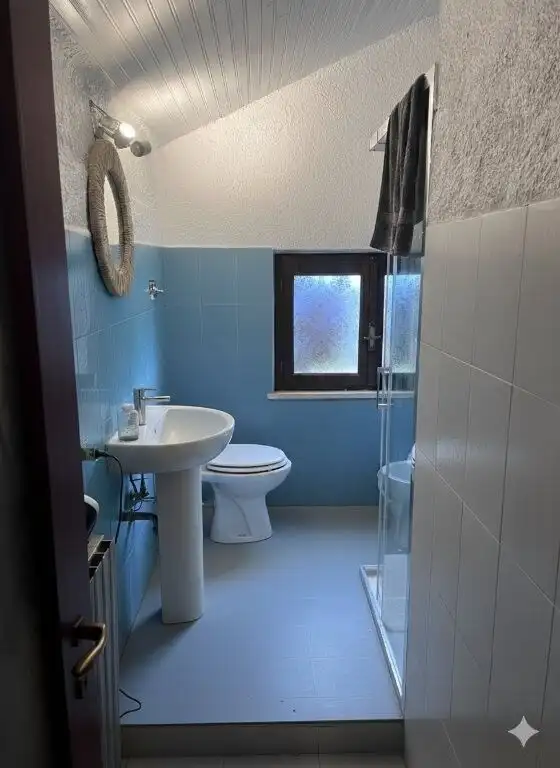 Cozy bathroom with modern fixtures in a beautiful villa in Mezzana Mortigliengo, Piedmont. Perfect f.