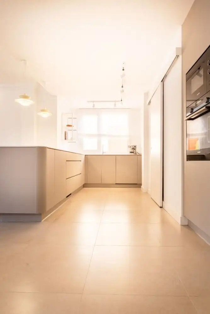 Bright, modern kitchen with sleek cabinetry and appliances in Estepona apartment.