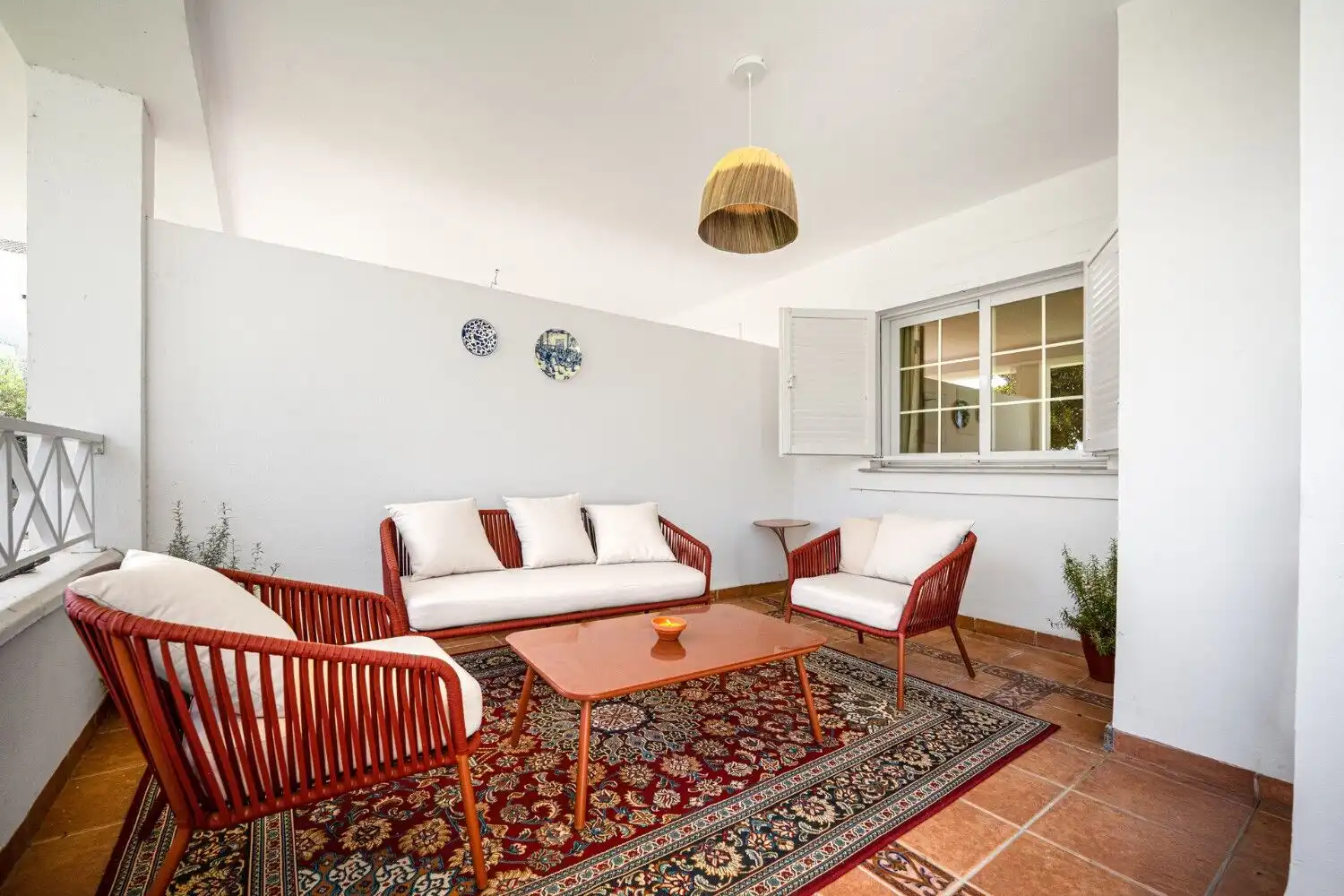 Bright living room with comfortable seating and natural light.
