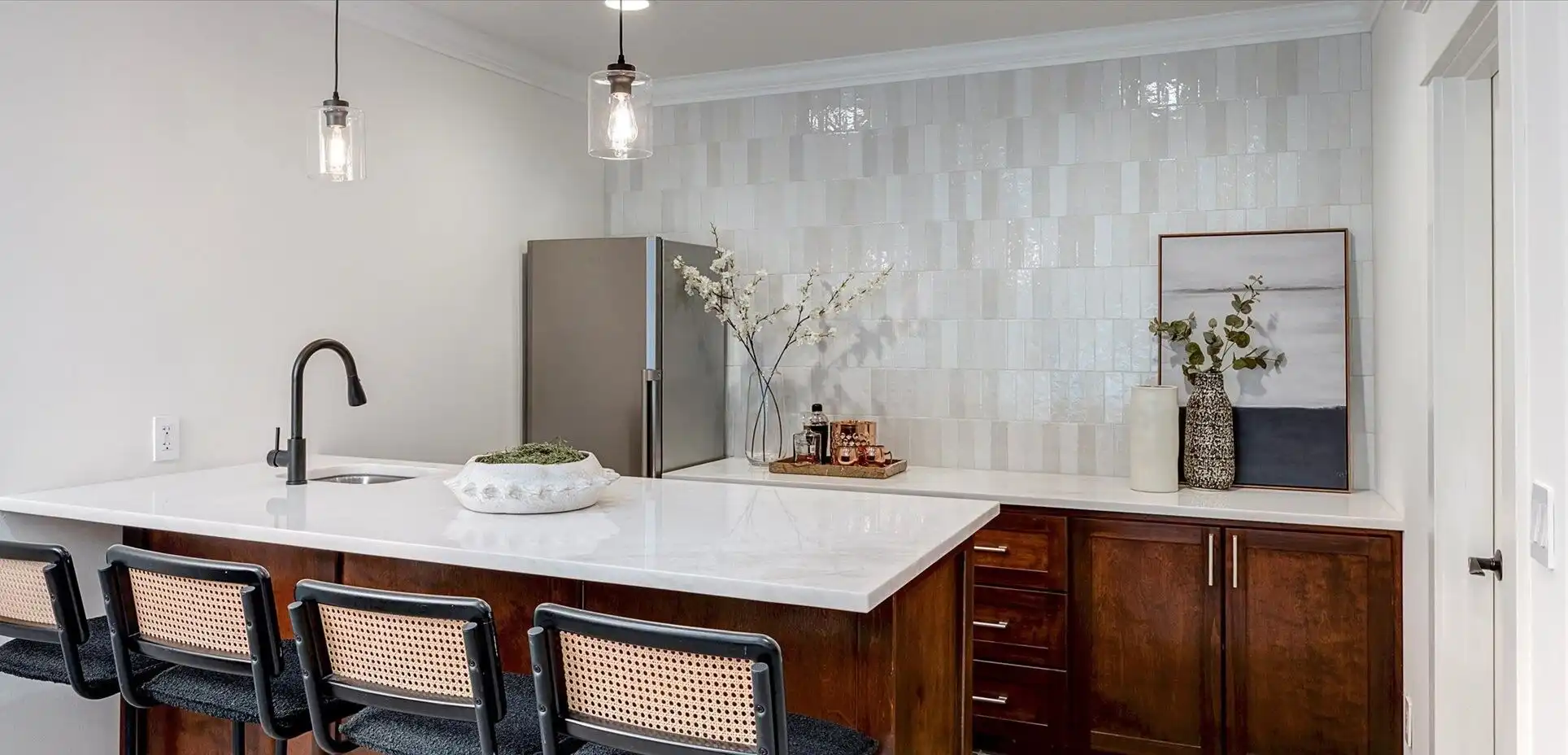 Contemporary kitchen featuring a sleek island, modern appliances, and stylish decor in a luxury lake.