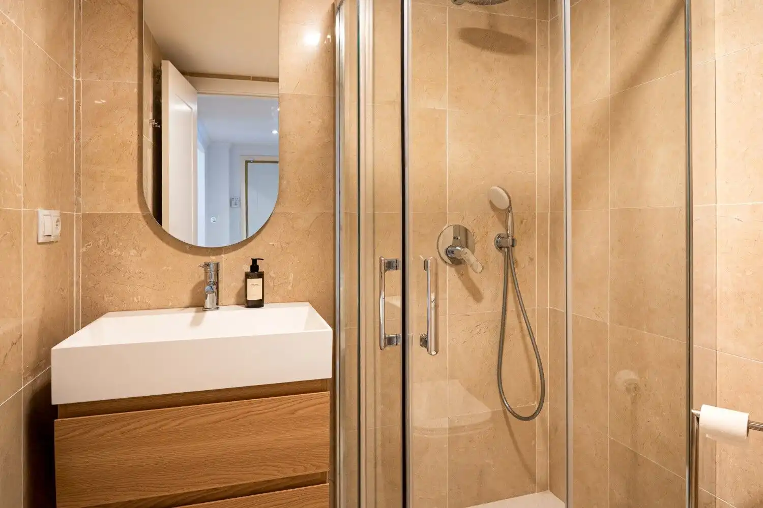 Bright, contemporary bathroom with walk-in shower and stylish fixtures in Marbella East.