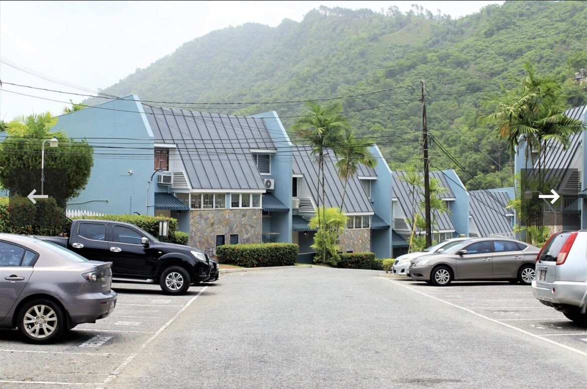 Stylish 2-bedroom townhouse for sale in Fairways Maraval, offering scenic mountain views.