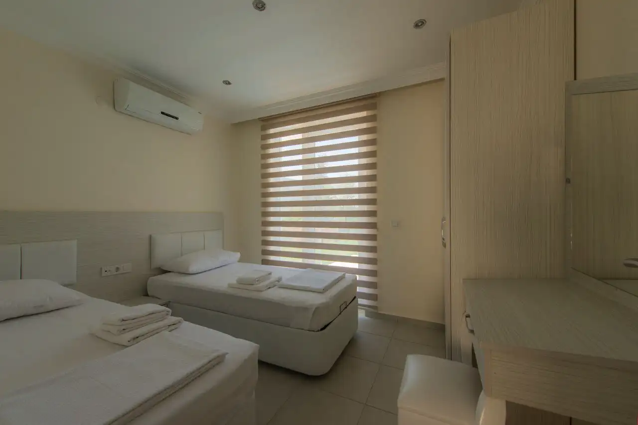 Modern 2-bedroom apartment in Orka Residence, Ovacık, featuring contemporary furnishings and scenic.