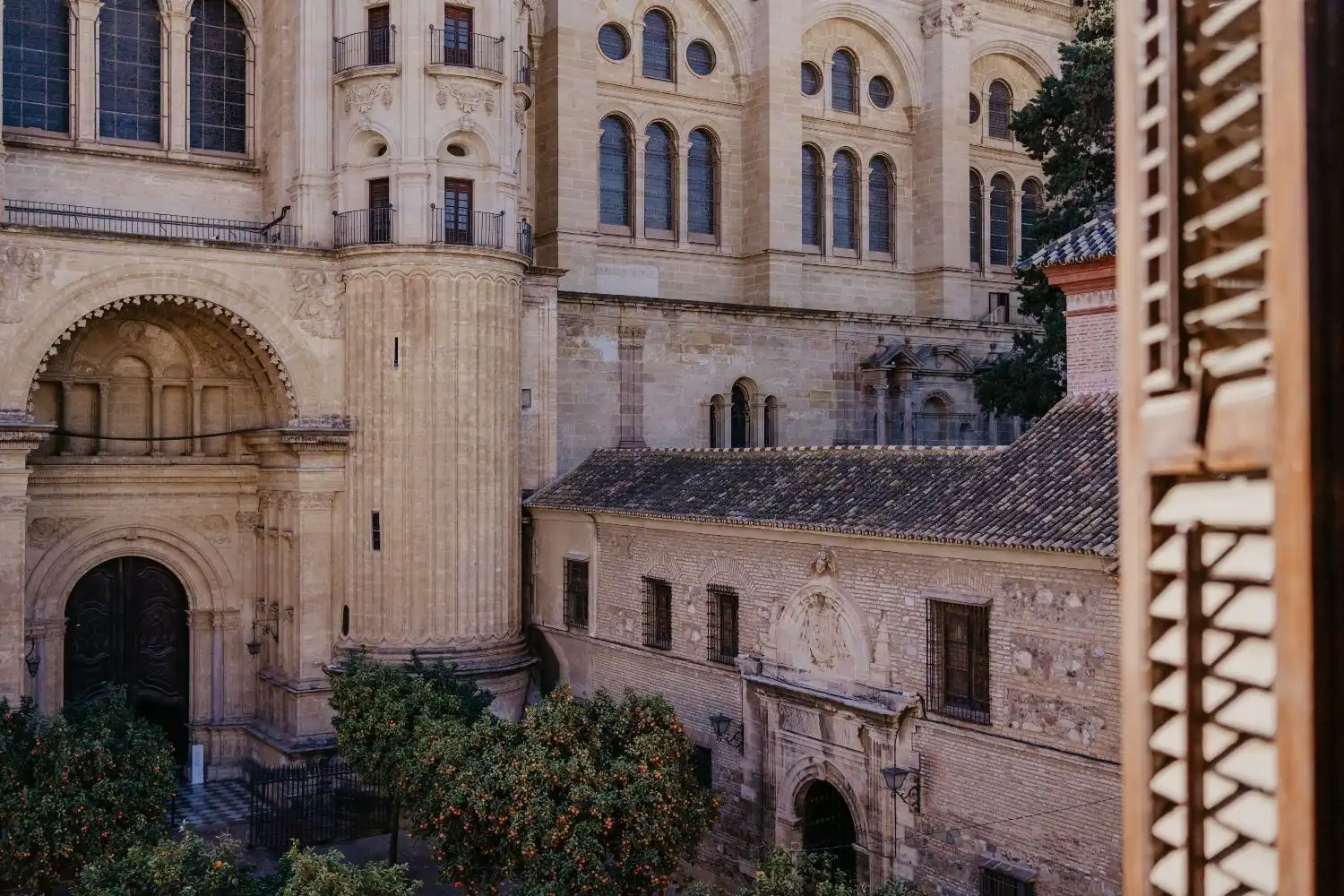 Penthouse apartment overlooking Malaga's historic cathedral and cityscape.