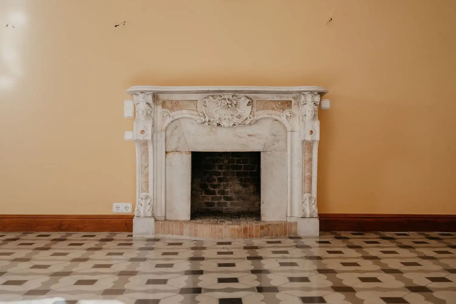 Classic fireplace in Malaga penthouse with elegant marble mantelpiece.