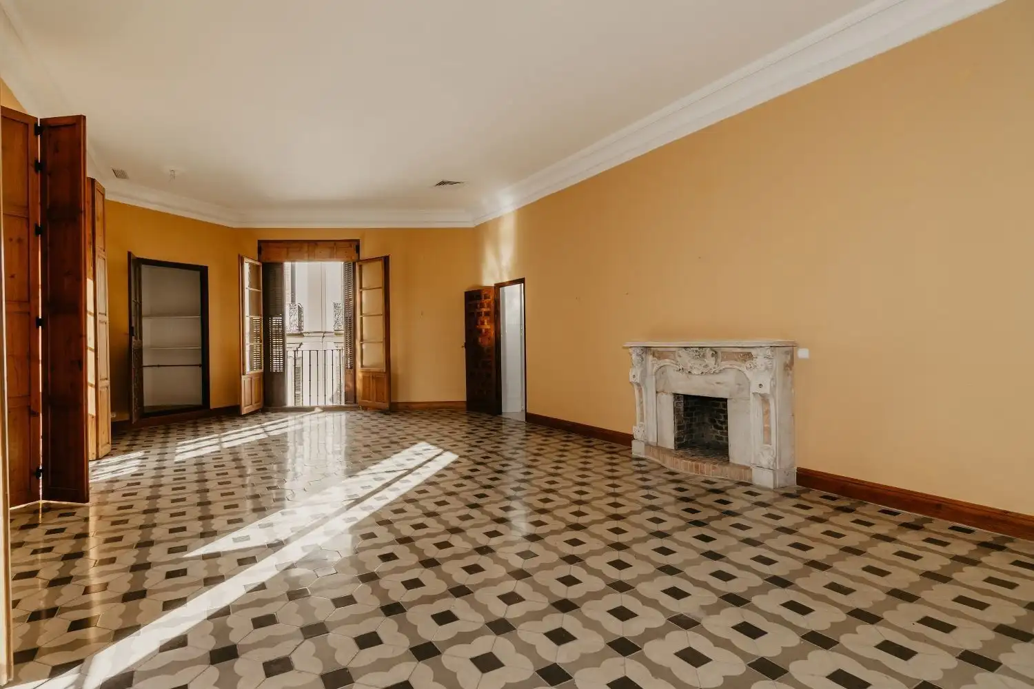 Spacious living room in a Malaga penthouse with elegant decor and large windows offering natural lig.