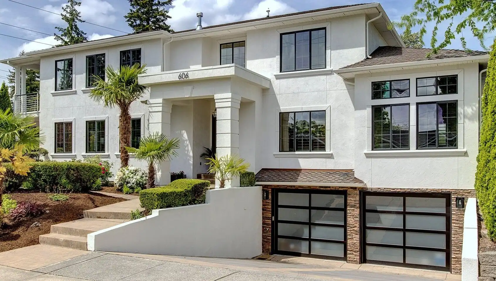 Modern luxury home with lakefront views and landscaped garden.