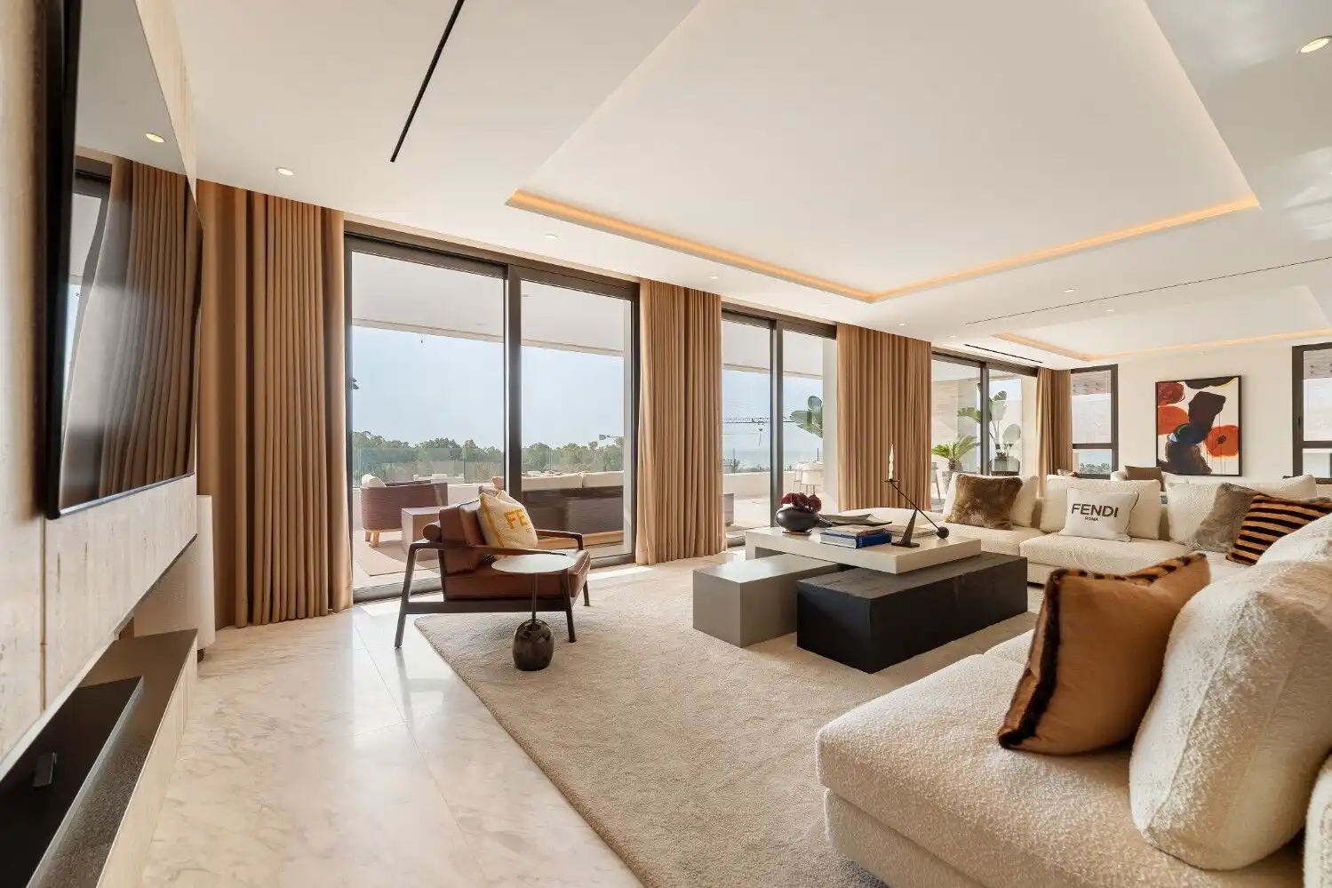Luxury Skyvilla living room with Fendi Casa furnishings and panoramic Marbella views.
