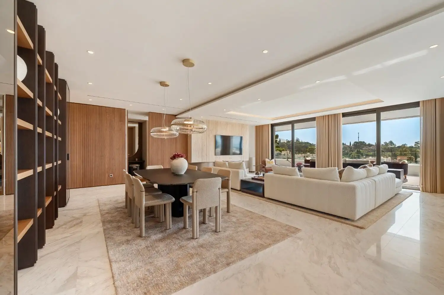 Elegant furnished skyvilla living room with modern decor and panoramic views in Marbella Golden Mile.