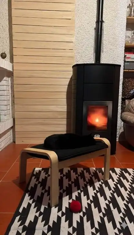 Indoor fireplace with a warm glow in a contemporary living space.