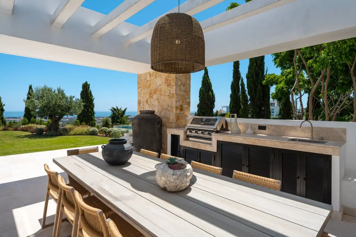 Luxury villa outdoor kitchen with stunning views and modern amenities. Perfect for entertaining in a.