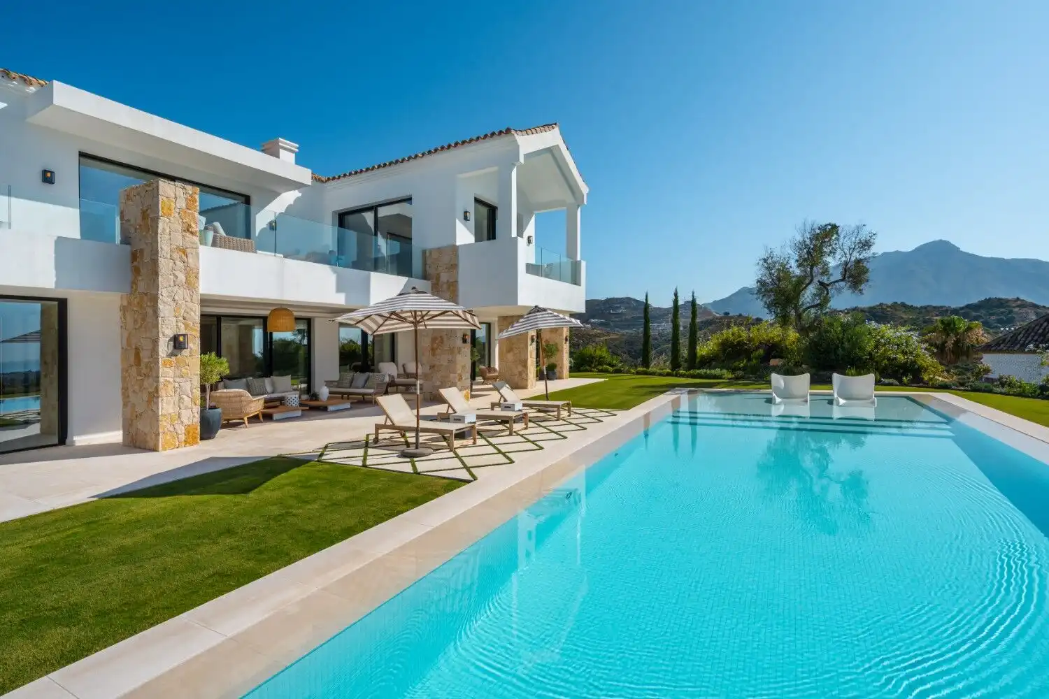 Luxury villa with private pool and stunning mountain scenery in El Herrojo. Perfect for exclusive li.