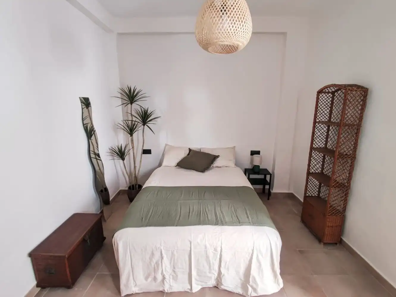 Charming independent casita bedroom in Torresoto with minimalist decor and natural light.