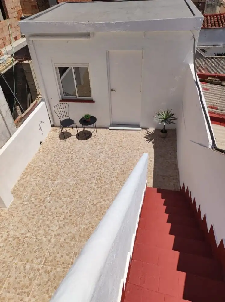 Small independent casita with terrace in Torresoto, featuring outdoor seating and potted plants.