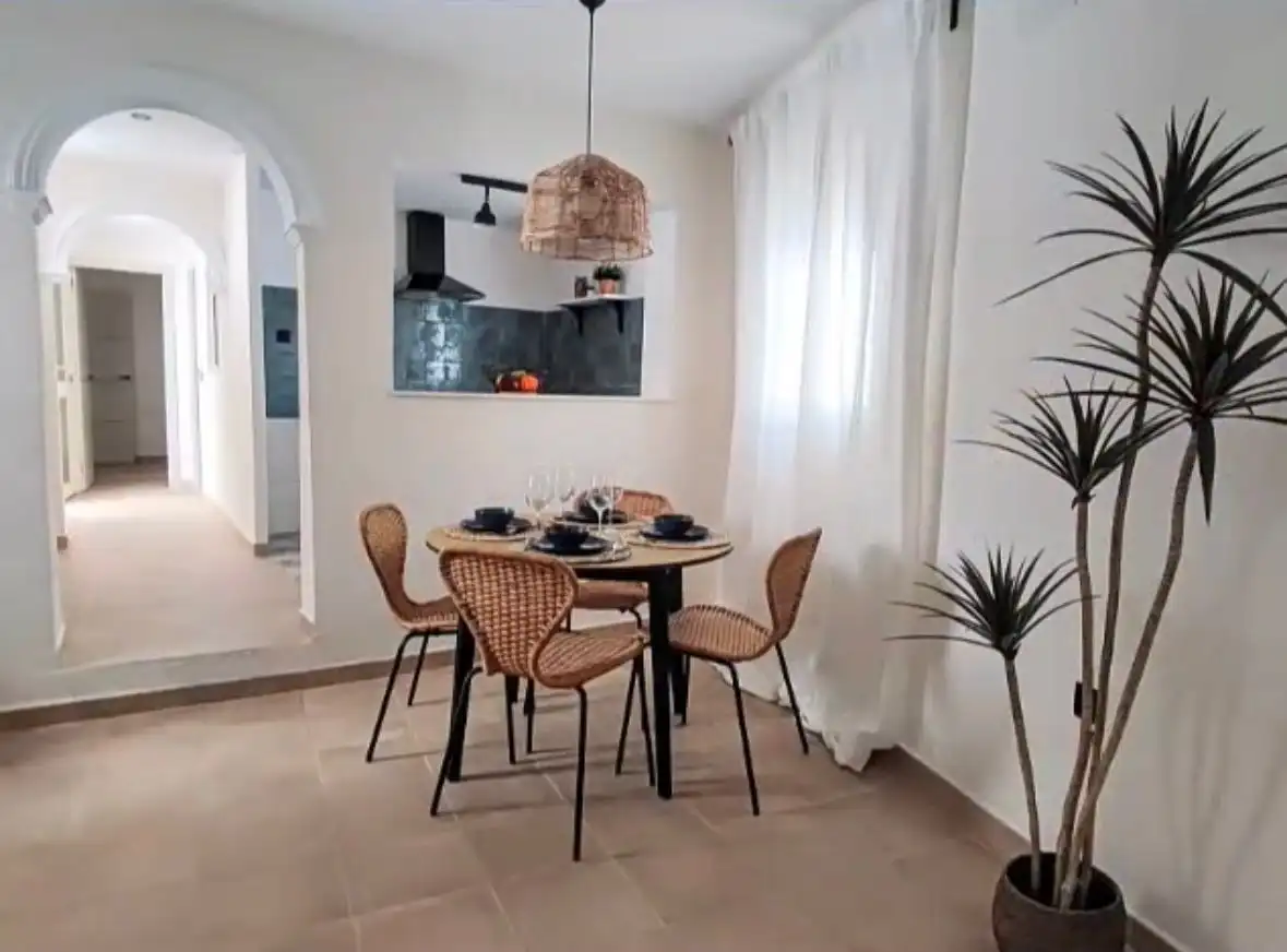 Cozy dining area in a quaint Torresoto independent casita with modern decor and natural light.